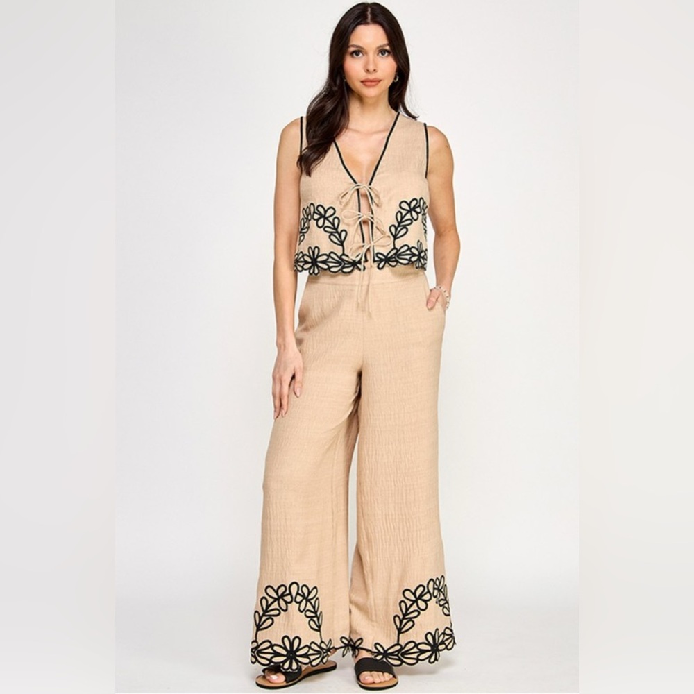 Chic Tan Jumpsuit with Black Floral Design